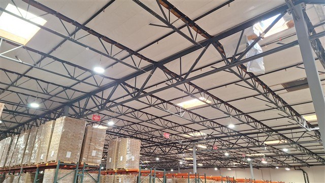 Warehouse interior with steel roof structure