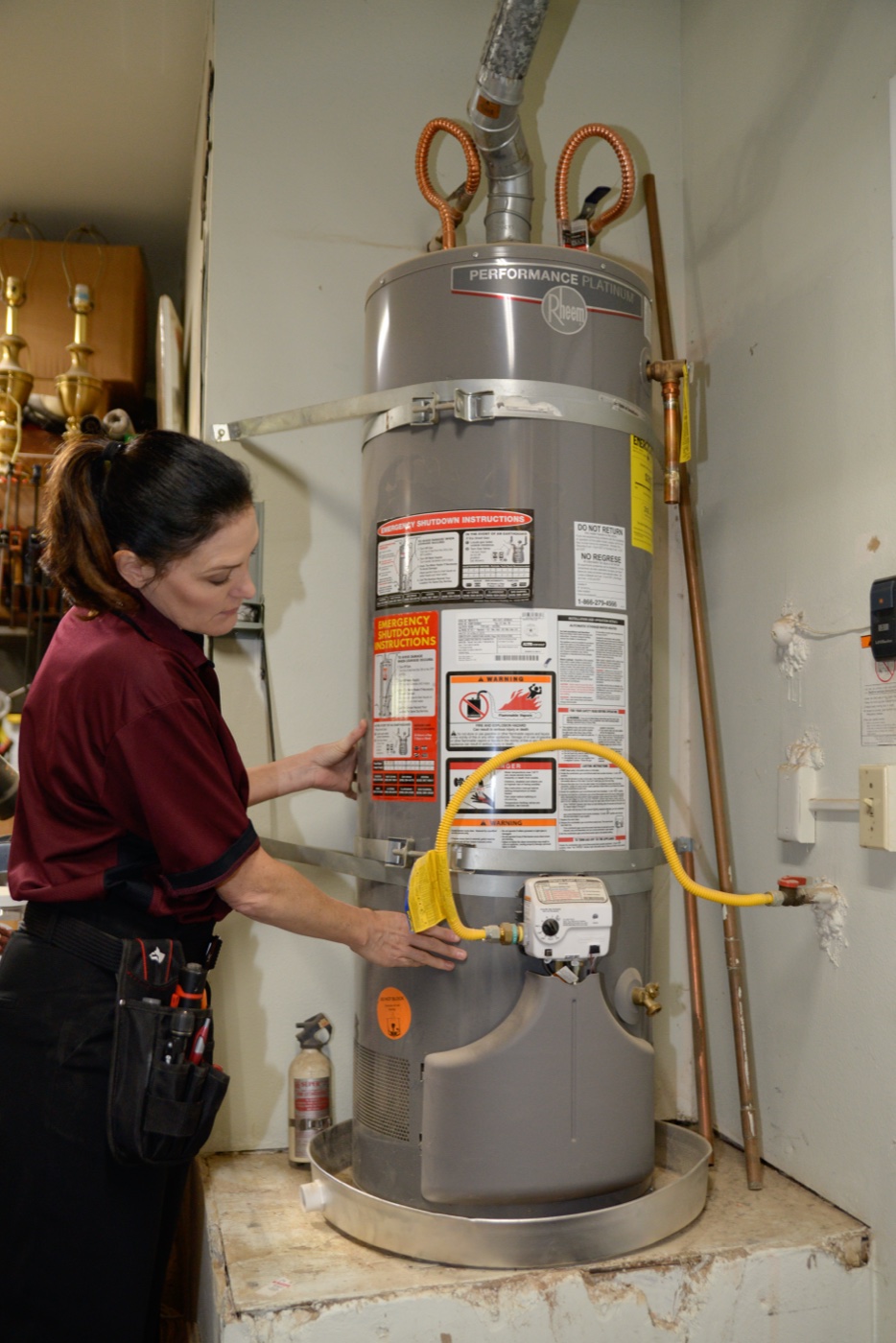 Morrison Plus inspector examining a water heater