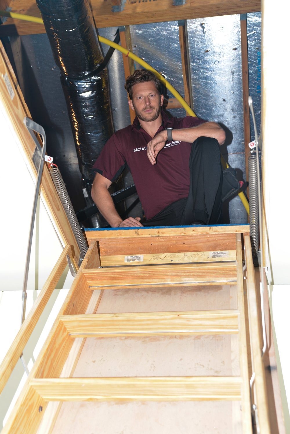 Morrison Plus inspector inspecting an attic access